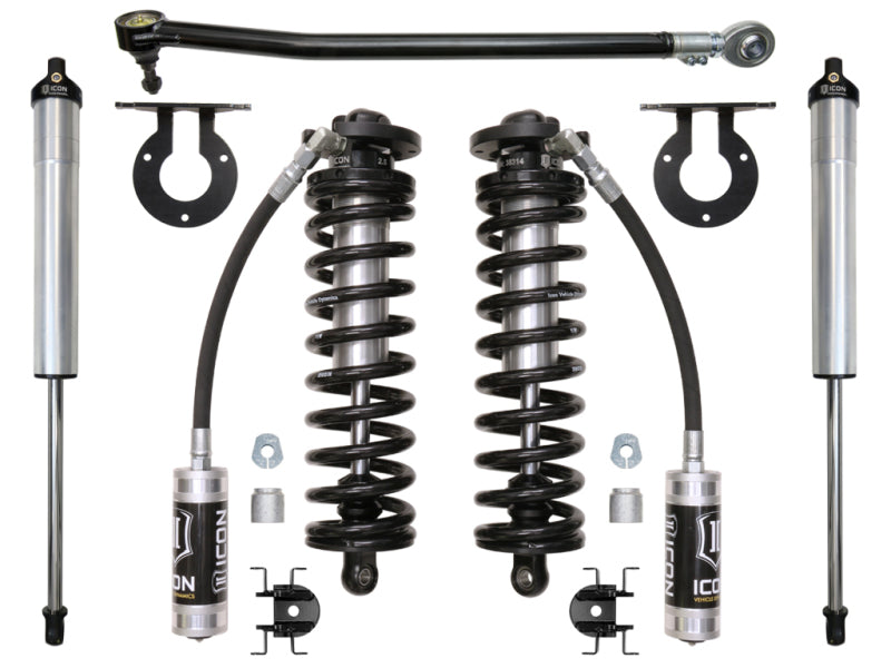 A layout of automotive suspension parts, featuring the ICON 2017+ Ford F-250/F-350 2.5-3in Stage 2 Coilover Conversion System, includes two Remote Reservoir Coilover shocks with ICON branding, two additional shock absorbers, a sway bar link, and various mounting hardware. The components are neatly arranged on a white background. Perfect for upgrading your 2017-UP F-250 with this coilover conversion kit.