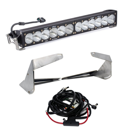 An automotive LED light bar kit designed specifically for 2019+ Ram 2500/3500 models, the Baja Designs 20 Inch OnX6+ Driving Combo Bumper Kit includes a sleek, black-cased light bar featuring multiple LED bulbs. The wiring harness comes with connectors, and metal mounting brackets are provided to secure the light bar effectively.