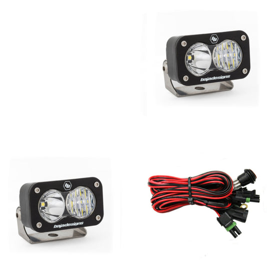 The Baja Designs S2 Sport Driving Combo Pair includes two rectangular LED light pods with clear lenses, red and black wiring with connectors, and gray mounting brackets. Featuring the logo on the front, these lights offer enhanced visibility for any project.