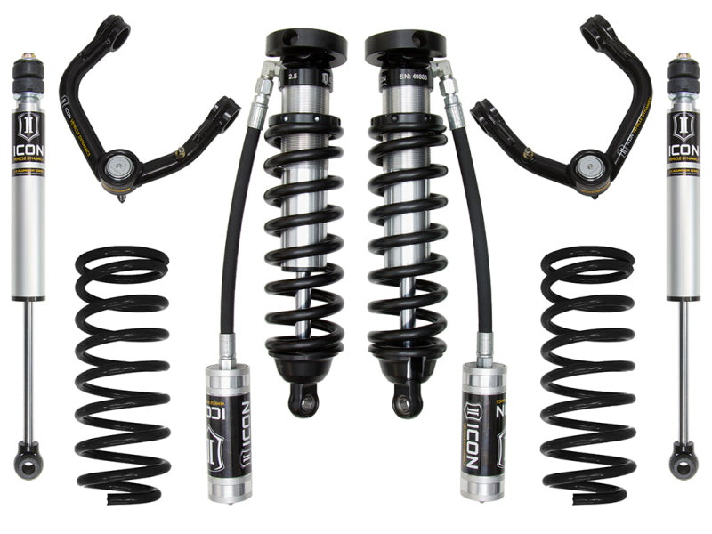 The ICON 96-02 Toyota 4Runner 0-3in Stage 3 Suspension System by ICON is showcased, including two coilover shocks, upper control arms with Delta Joint technology, additional coil springs, and shock absorbers with remote reservoirs. The components are neatly arranged on a white background.