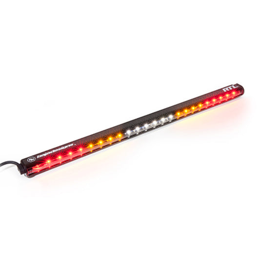 The Baja Designs RTL Single Straight 30in Light Bar showcases a sleek design with red, amber, and white lights encased in a black housing. The power cable attached to one end creates a striking contrast against the white background.