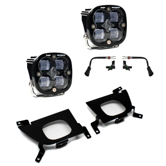 The Baja Designs 2019+ Silverado Fog Pocket for Silverado 1500/2500/2500 HD FPK SAE includes two rectangular LED light units with multiple bulbs and black casings, wiring harnesses, and two black metal mounting brackets. Perfect for fog pocket installations on your Silverado 1500 or 2500.