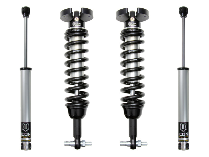 A pair of black automotive suspension coilovers with silver shock absorbers, enhancing ride quality and wheel travel. Labeled with the brand name "ICON," these ICON 2019+ GM 1500 1.5-3.5in Stage 1 Suspension Systems are arranged vertically against a white background.