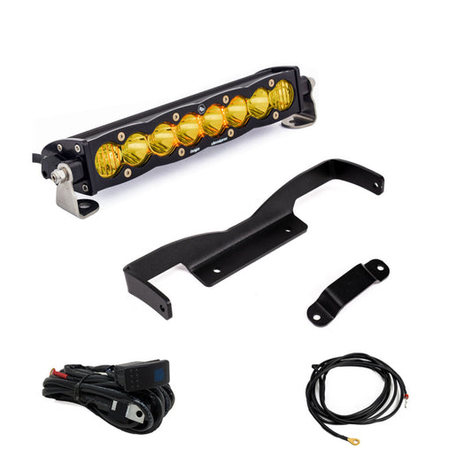 The Baja Designs Can-Am Maverick R Amber 10in S8 Shock Tower Kit features a yellow lens LED light bar with mounting brackets, wiring harness, and extra cable, designed to enhance your Can-Am Maverick, displayed on a white background.