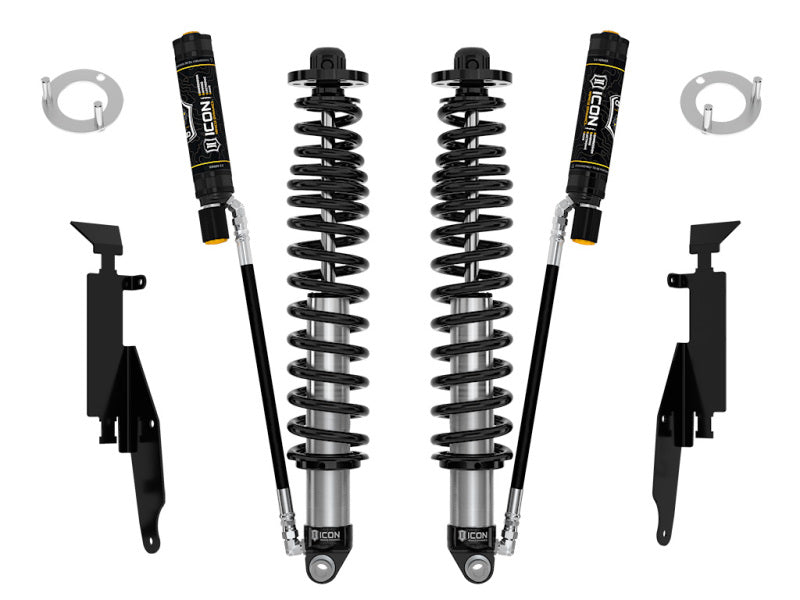 Image of two ICON 21+ Ford Bronco 2-3in Rear 2.5 VS RR CDEV COILOVER shocks with black coil springs and attached reservoirs. The set includes mounting brackets and various accessories for installation. Components are symmetrically arranged against a white background, designed to enhance your Ford Bronco's performance with precision compression damping electronic valves (CDEV).