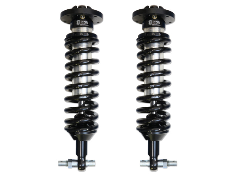 Image of two identical black ICON 07-18 GM 1500 1-3in 2.5 Series Shocks VS IR Coilovers with springs, designed for vehicles. Each coilover features a prominently displayed "ICON" logo at the top and polished metal components at the bottom, indicating rugged construction and high-performance capabilities—perfect off-road shocks for Chevrolet GMC vehicles seeking lift height.