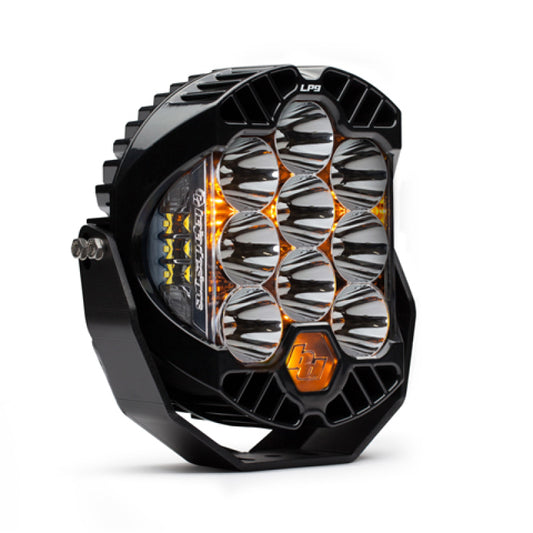 The Baja Designs LP9 Series LED Light Pods in clear offer an intricate hexagonal off-road design with circular lens arrangements, a durable housing, and a small logo, ideal for high-speed spot patterns.
.