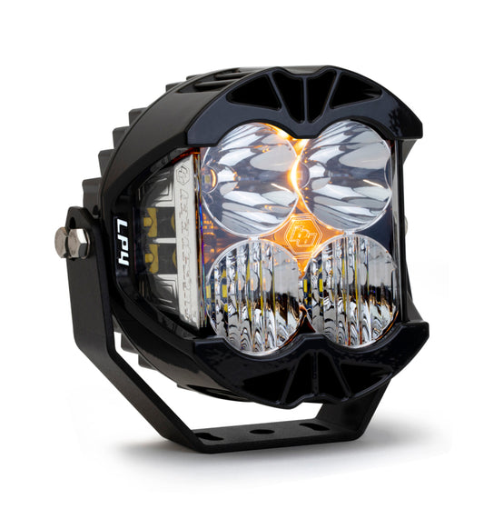 The Baja Designs LP4 Pro Driving/Combo LED - Clear offers enhanced visibility with four round lenses and a durable mounting bracket. Its sleek black design features a striking yellow accent, perfect for off-road adventures.